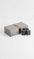 Modern mahjong set with sleek packaging., Focus on a 3/4 angle shot for the mahjong set to capture both its depth and...